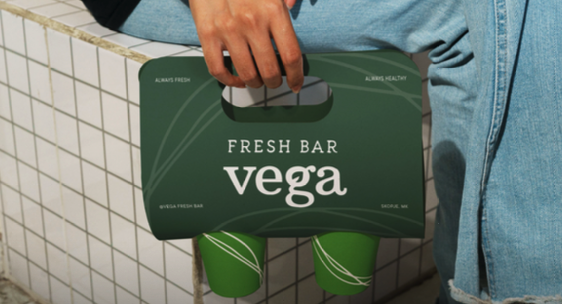 Cold-pressed juices in a Vega Fresh Bar carrier, ready to go